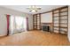 Spacious living room with hardwood floors, fireplace, and built-in shelving at 5240 Deer Creek Dr, Indianapolis, IN 46254