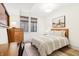 Bright bedroom with mid-century modern furniture and hardwood floors at 583 Exmoor Dr, Carmel, IN 46032