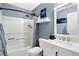 Modern bathroom featuring a white vanity, bathtub/shower combo, and updated fixtures at 600 Brookline Dr, Danville, IN 46122