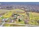 Aerial view of a property with a house, barn, pond, and expansive land at 7021 Bellsville Pike, Columbus, IN 47201