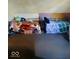 Small bedroom with twin beds and colorful bedding at 7021 Bellsville Pike, Columbus, IN 47201