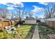 Spacious backyard with detached garage, fire pit, and patio furniture at 2335 Union St, Indianapolis, IN 46225