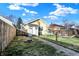 Fenced backyard with patio furniture, fire pit, and walkway to house at 2335 Union St, Indianapolis, IN 46225