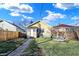 Fenced backyard with patio furniture, fire pit, and walkway leading to house at 2335 Union St, Indianapolis, IN 46225