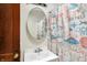 Bathroom with ocean-themed shower curtain, white vanity, and mirror at 2335 Union St, Indianapolis, IN 46225