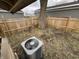 Fenced backyard with AC unit and large tree at 416 N Mulberry St, Muncie, IN 47305