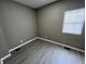 Additional bedroom with gray walls and wood-look flooring at 416 N Mulberry St, Muncie, IN 47305