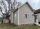 Side view of a two-story home with updated siding at 416 N Mulberry St, Muncie, IN 47305