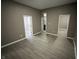 Open living area with gray walls and wood-look flooring at 416 N Mulberry St, Muncie, IN 47305