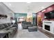 Spacious living room features hardwood floors, a fireplace, and an open floor plan at 4725 W Harrisburg Ct, New Palestine, IN 46163