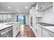 Modern kitchen featuring white shaker cabinets, stainless steel appliances, gas range, and white quartz countertops at 5655 Lighthouse Dr, Brownsburg, IN 46112