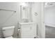 Clean and modern bathroom with marble-topped vanity and updated fixtures at 620 N Rural St, Indianapolis, IN 46201
