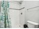 Clean and bright bathroom with white subway tile, shower, and updated fixtures at 620 N Rural St, Indianapolis, IN 46201