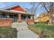View of the duplex's front entrance and walkway at 620 N Rural St, Indianapolis, IN 46201