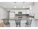 Contemporary kitchen featuring white cabinets, granite counters, and pendant lights at 620 N Rural St, Indianapolis, IN 46201