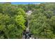 Aerial view of home with private dock, surrounded by lush trees, and waterfront access at 7701 Center Lake Rd, Nineveh, IN 46164