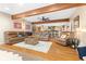 Finished basement featuring exposed beams, leather furniture, and a bar area at 7701 Center Lake Rd, Nineveh, IN 46164