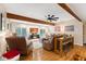 Finished basement with sliding glass doors, exposed beams and a leather sectional at 7701 Center Lake Rd, Nineveh, IN 46164