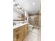 Modern bathroom featuring dual vanities, glass shower, and updated fixtures at 7701 Center Lake Rd, Nineveh, IN 46164