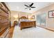 Basement bedroom with wooden furniture, ceiling fan, and sliding glass door at 7701 Center Lake Rd, Nineveh, IN 46164