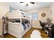 Charming bedroom with bunk beds, work space, and hardwood floors at 7701 Center Lake Rd, Nineveh, IN 46164