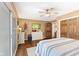 Bedroom with wood floors, ceiling fan, and a large closet at 7701 Center Lake Rd, Nineveh, IN 46164