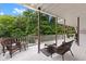 Spacious deck with seating area overlooking the in-ground pool at 7701 Center Lake Rd, Nineveh, IN 46164