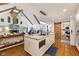 Modern kitchen with island cooktop, farmhouse sink, and sliding barn door to laundry at 7701 Center Lake Rd, Nineveh, IN 46164