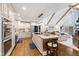 Bright open-concept kitchen and living area with vaulted ceilings and exposed beams at 7701 Center Lake Rd, Nineveh, IN 46164