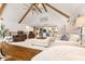 Cozy living space with vaulted ceilings, exposed beams, and plentiful seating at 7701 Center Lake Rd, Nineveh, IN 46164