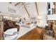 Living area with wood floors, fireplace, and view of the kitchen at 7701 Center Lake Rd, Nineveh, IN 46164