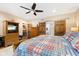 Main bedroom in basement with wooden furniture, TV, and ensuite bathroom access at 7701 Center Lake Rd, Nineveh, IN 46164