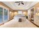 Main bedroom with plush carpet, private balcony access, and an ensuite bathroom at 7701 Center Lake Rd, Nineveh, IN 46164