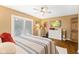 Spacious main bedroom with wood floors, sliding glass doors, and a ceiling fan at 7701 Center Lake Rd, Nineveh, IN 46164