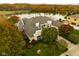 Luxury home with lake views and spacious grounds in autumn at 8804 Waterside Dr, Indianapolis, IN 46278