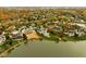 Aerial view of a lakefront community showcasing homes with fall foliage at 8804 Waterside Dr, Indianapolis, IN 46278