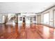 Open basement area with hardwood floors and staircase at 8804 Waterside Dr, Indianapolis, IN 46278