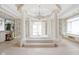 Spa-like bathroom with soaking tub and columns at 8804 Waterside Dr, Indianapolis, IN 46278