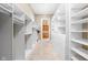 Walk-in closet with built-ins and access to laundry at 8804 Waterside Dr, Indianapolis, IN 46278
