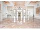 Grand entryway with high ceilings, marble floors, and a large chandelier at 8804 Waterside Dr, Indianapolis, IN 46278