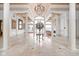 Spacious entryway with high ceilings, marble floors, and a large chandelier at 8804 Waterside Dr, Indianapolis, IN 46278