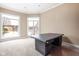 Bright home office features large windows overlooking the backyard pool and patio at 8804 Waterside Dr, Indianapolis, IN 46278