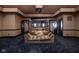 Home theater with large screen and comfortable seating at 8804 Waterside Dr, Indianapolis, IN 46278