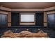 Home theater with large screen and comfortable seating at 8804 Waterside Dr, Indianapolis, IN 46278