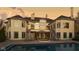Back exterior of a luxurious two story home with a pool and gazebo at 8804 Waterside Dr, Indianapolis, IN 46278
