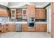 Kitchen with custom cabinetry, stainless steel appliances, and a decorative backsplash at 8804 Waterside Dr, Indianapolis, IN 46278