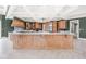 Spacious kitchen boasts a large island, custom cabinetry, and stainless steel appliances at 8804 Waterside Dr, Indianapolis, IN 46278