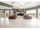 Bright living room with fireplace, hardwood floors, and large windows at 8804 Waterside Dr, Indianapolis, IN 46278