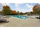 Inviting in-ground pool with slide, spa, and lake view at 8804 Waterside Dr, Indianapolis, IN 46278