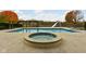 Inviting in-ground pool with slide, spa, and lake view at 8804 Waterside Dr, Indianapolis, IN 46278